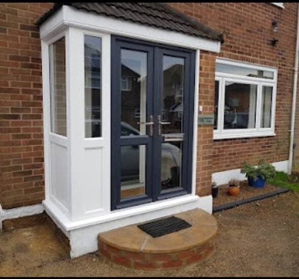 Refurbished porch with new grey French doors and paved step