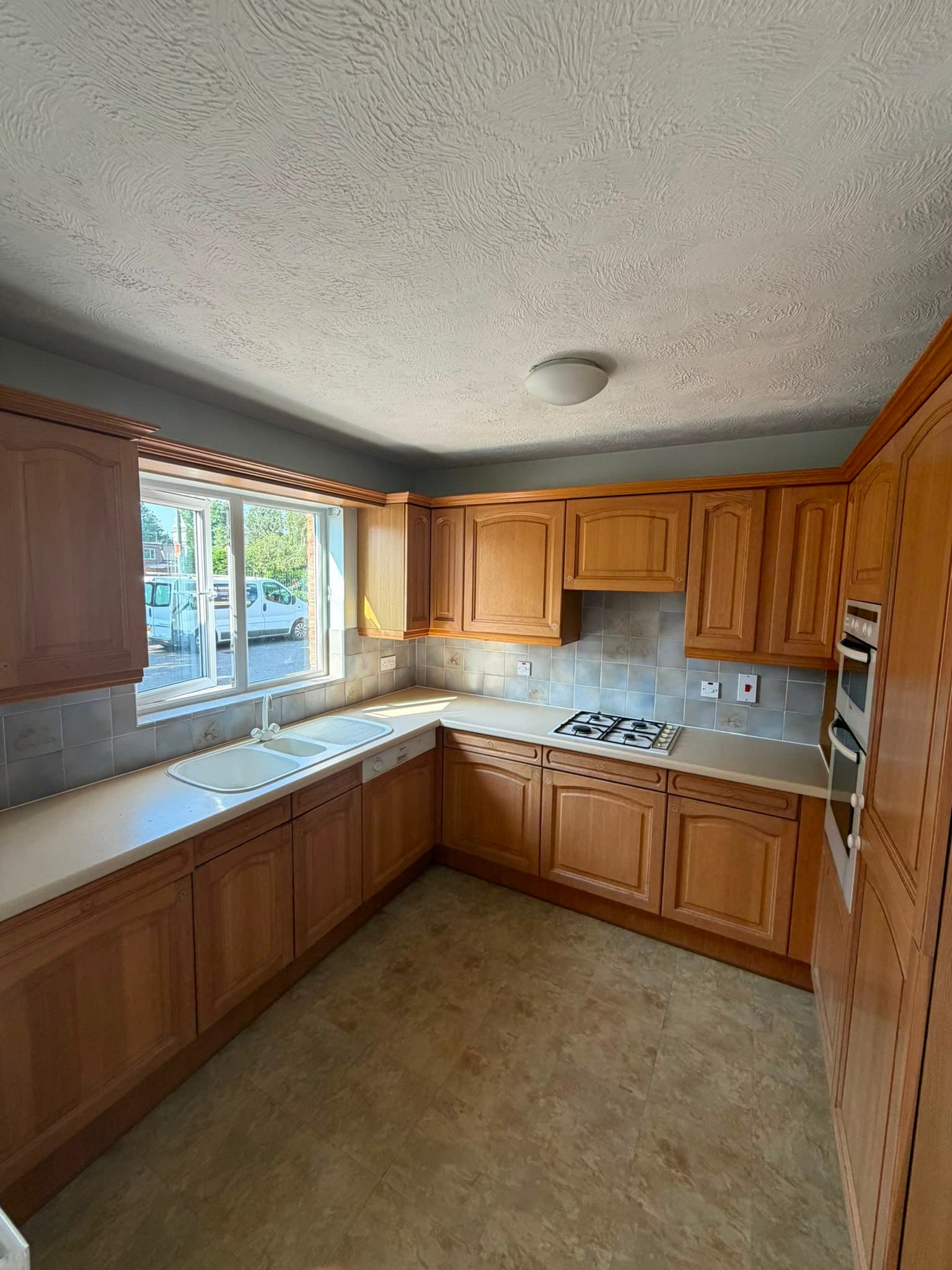 Traditional kitchen with wood cabinets before renovation - Littlehampton